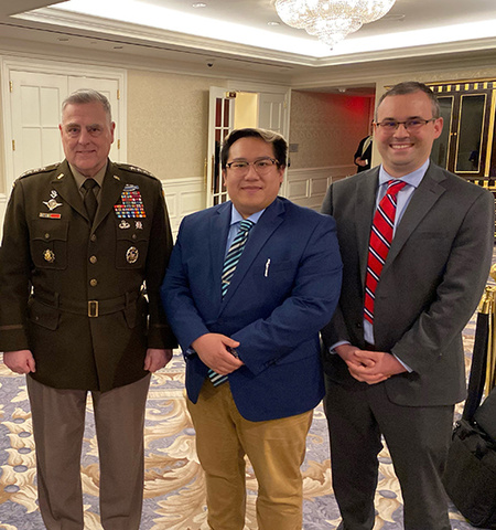 John Glenn College of Public Affairs MPA-DC graduate Brian Nguyen Le, second from right, poses for a photo at the Special Competitive Studies Project’s Ash Carter Exchange on Innovation and National Security with (from left) Gen. Mark A. Milley (ret.), 20th Chairman of the Joint Chiefs of Staff, and Tom Seaman, legislative director.