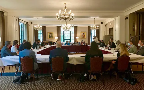 UK diplomats sitting at a dinner table