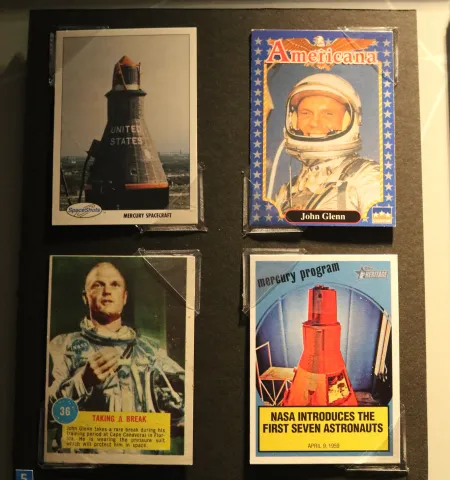 four bubble gum trading cards with images of John Glenn in space suit and Friendship 7 space craft