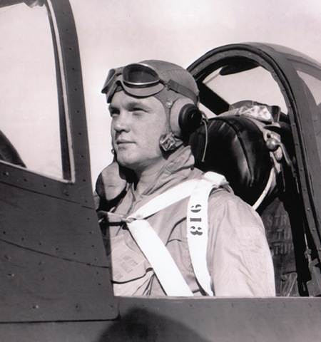 John Glenn in cockpit of fighter jet