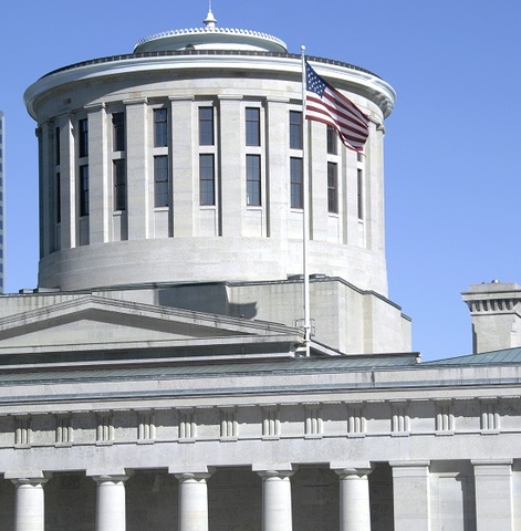 ohio statehouse building with American flag flying