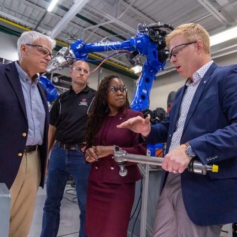HAMMER Director Glenn Daehn (left) discusses advance manufacturing at the AIMS Lab with Nate Ames, Dean Ayanna Howard and Michael Groeber