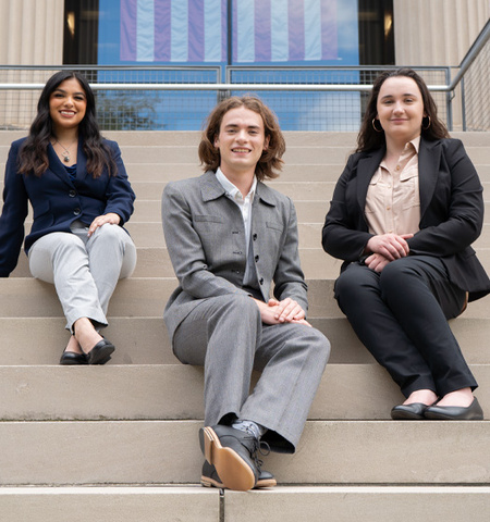 Glenn College students Lauren Gonzalez, Clovis Westlund and Ruby Lobert sitting on the front steps of Page Hall.