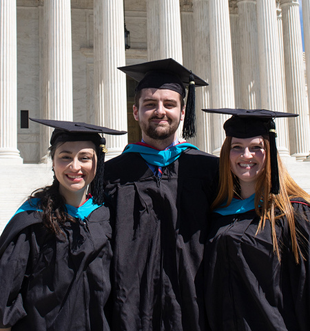 John Glenn College of Public Affairs MPA-DC 2022 students (from left) Carynne Jarrell, Matthew Fisher and Sarah Pol graduation gowns at the U.S. Supreme Court