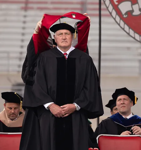 Retired four-star Army Gen. John M. Murray, an Ohio State graduate, is hooded for an Honorary Doctor of Public Service degree at the university’s spring commencement.