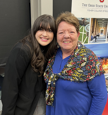 Emily Henson and Nila Whitfield pose for a photo at a Fisher College of Business event in 2022.