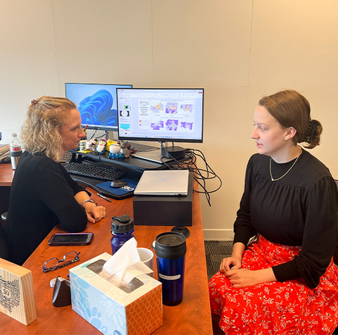 Glenn College student Josephine Harders (right) shares her internship presentation, “Financing Public Transportation in Ohio,” with Charlotte Kirschner, fiscal research supervisor in the research and performance section at the Ohio Office of Budget and Management.