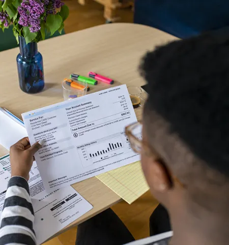 A person looking at an electricity bill (Getty Images)