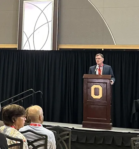 John Horack, the Neil Armstrong Chair in Aerospace Policy at Ohio State, gives remarks at a podium