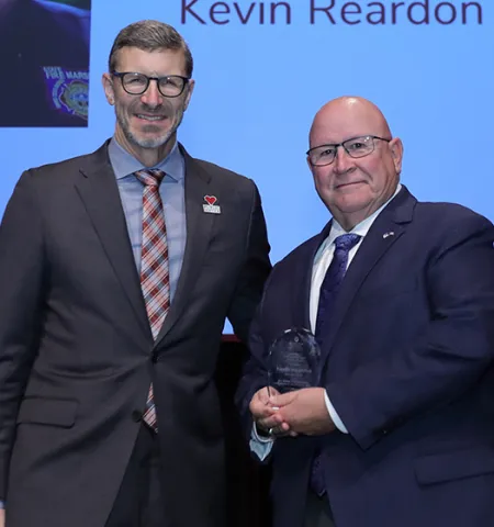 Dean Trevor Brown, left, presents the John Glenn College of Public Affairs Outstanding Public Service Award to Ohio’s State Fire Marshal, Kevin Reardon.