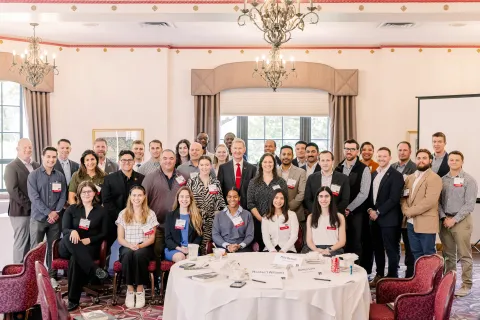 President Carter with a group of students in ballroom at Service to Service event
