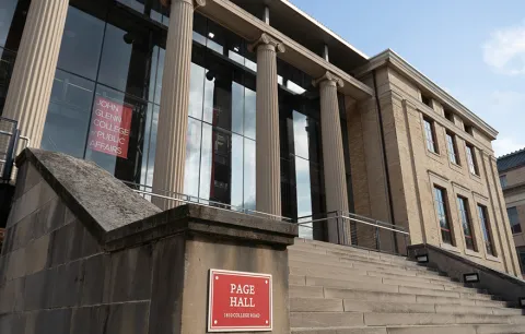 The front steps, building sign and windows of Page Hall, home of the John Glenn College of Public Affairs at The Ohio State University