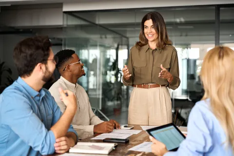 Woman discussing with team.