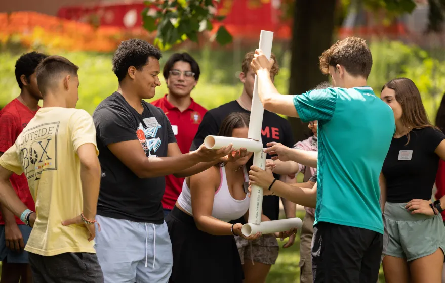Students work together to build structure in community builder activity.