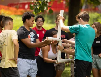 Students work together to build structure in community builder activity.